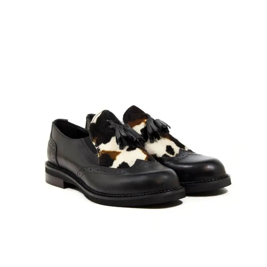 Mocassino in pelle con inserto animalier e nappine